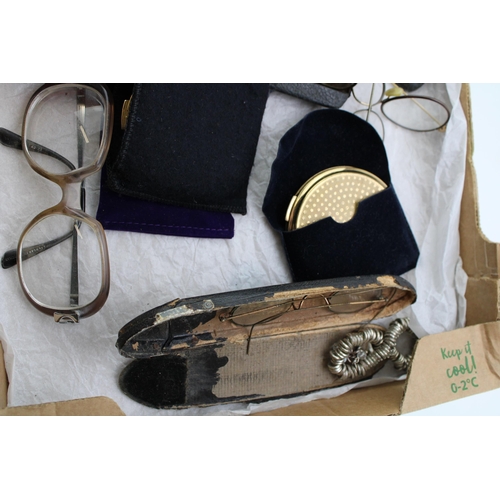 27 - A mixed collection of items to include vintage and antique spectacles, a Parker pen, a Ronson 15v li... 