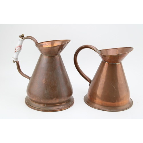 51 - A pair of vintage copper haystack jugs