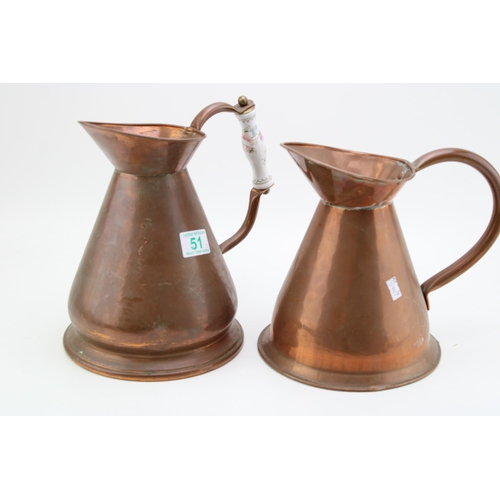 51 - A pair of vintage copper haystack jugs