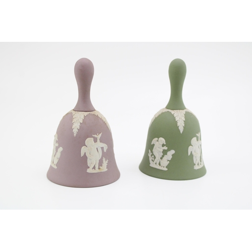 72 - A Wedgwood Jasperware bell in lilac together with another example in sage green colour way. Height 1... 