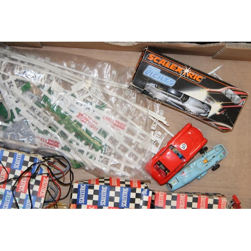 76 - A collection of vintage Scalextric items to include track, transformer and cars and spare parts for ... 