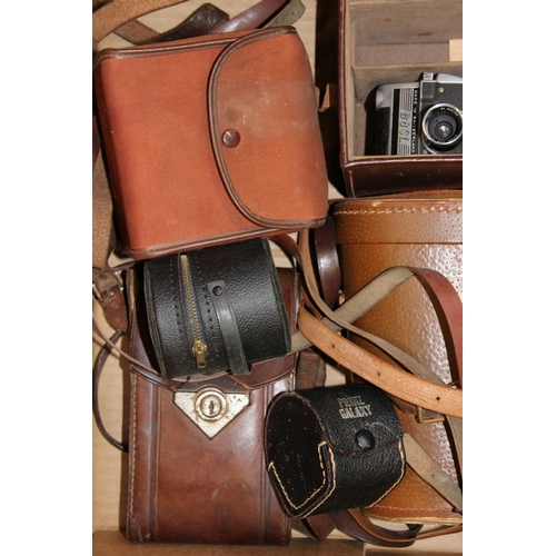 83 - A collection of binoculars and vintage camera equipment to include a pair of LIEBERMAN & GORTZ 20x40... 