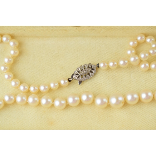 510 - A single row graduated cultured pearl necklace with 9ct white gold clasp, set rose-cut diamond, 54cm... 