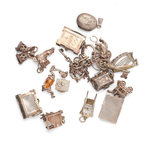 172 - A collection of silver charms for silver charm bracelets to include a treasure chest with hinged lid... 