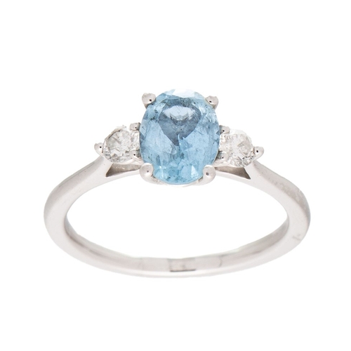 222 - A platinum, aquamarine and diamond dress ring, the oval cut stone 7.9 by 6.1mm, flanked by a diamond... 