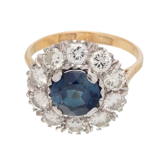 502 - An Art Deco 18ct gold, platinum, sapphire and diamond dress ring, the central deep royal blue sapphi... 