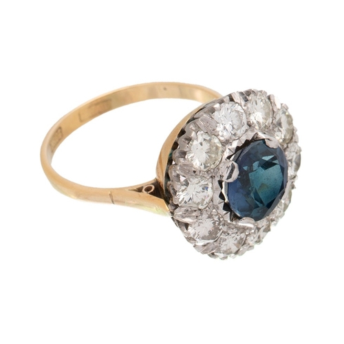 502 - An Art Deco 18ct gold, platinum, sapphire and diamond dress ring, the central deep royal blue sapphi... 