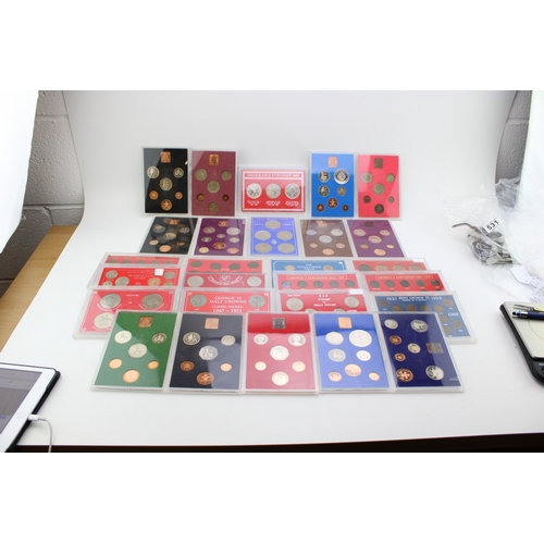 101 - A large collection of UK cased coin sets to include Royal Mint examples such as 1980, 1974, 1973, 19... 