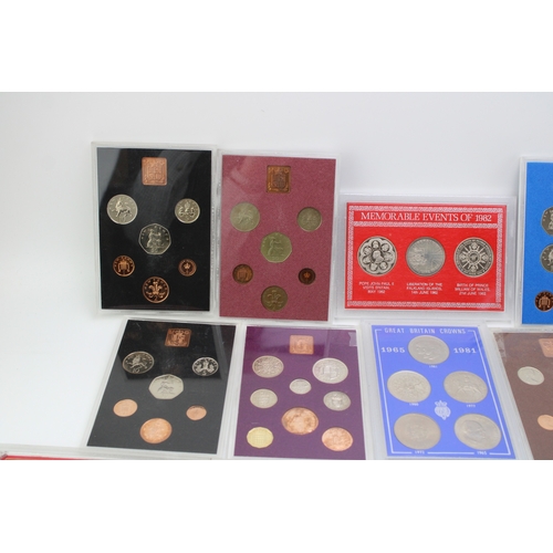 101 - A large collection of UK cased coin sets to include Royal Mint examples such as 1980, 1974, 1973, 19... 