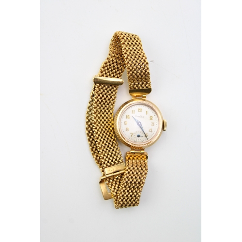 11 - A lady's Audax 9ct gold cased wristwatch, with 9ct gold woven belt form bracelet strap, marked 9ct t... 