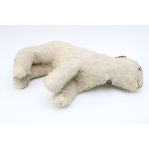 1133 - A vintage straw filled stuffed toy lamb 'Reverend', original glass c1930s. Height 25cm.