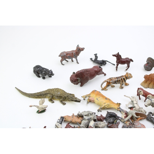 1136 - A collection of Britain's lead animal figures to include a crocodile, cows, jungle animals and other... 