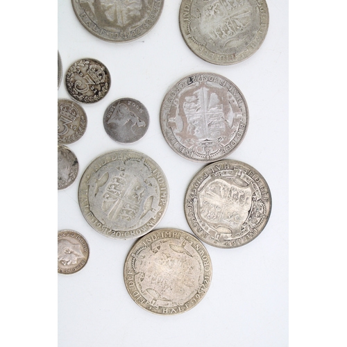 114 - A collection of UK silver coinage to include ten 1/2 crowns, (136.2g) together with four pre 1920 3d... 