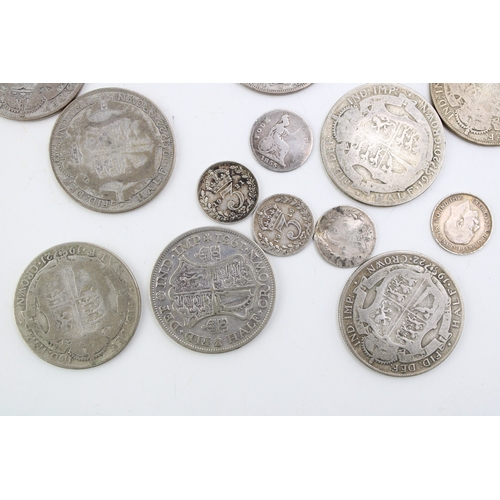 114 - A collection of UK silver coinage to include ten 1/2 crowns, (136.2g) together with four pre 1920 3d... 