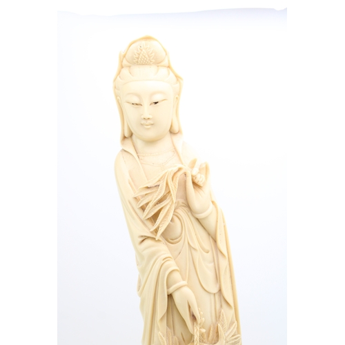 1148 - A large resin ivory style carved sculpture of a lady holding basket. Height 61cm.