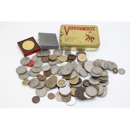 115 - A mixed collection of UK and foreign coinage to include a Coronation Souvenir Medal and other simila... 