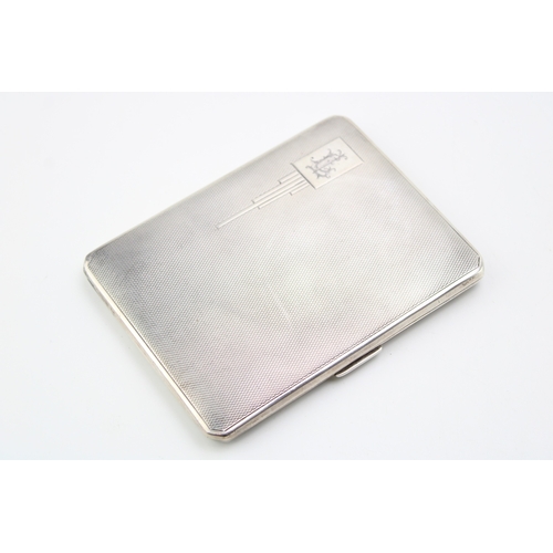 121 - A silver cigarette case with engine turned decoration, hallmarked Birmingham. Weight 172.5g.