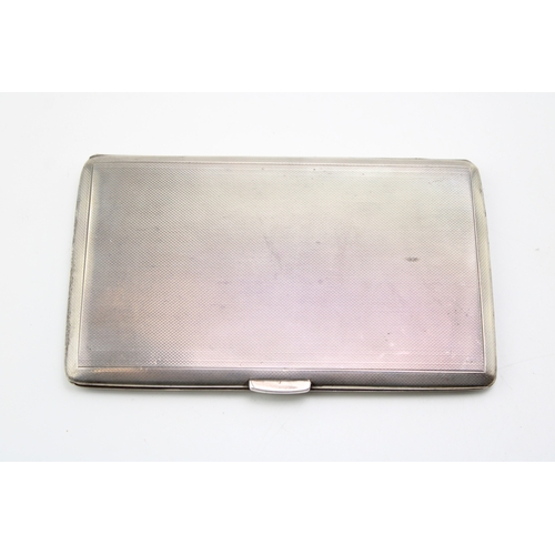 122 - A silver cigarette case with engine turned decoration, hallmarked Birmingham. Weight 211.5g.