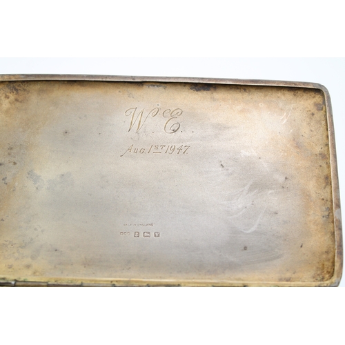 122 - A silver cigarette case with engine turned decoration, hallmarked Birmingham. Weight 211.5g.