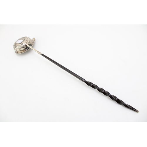 128 - A silver toddy ladle, likely 18th century with Queen Anne half crown inset, the bowl with rococo cha... 