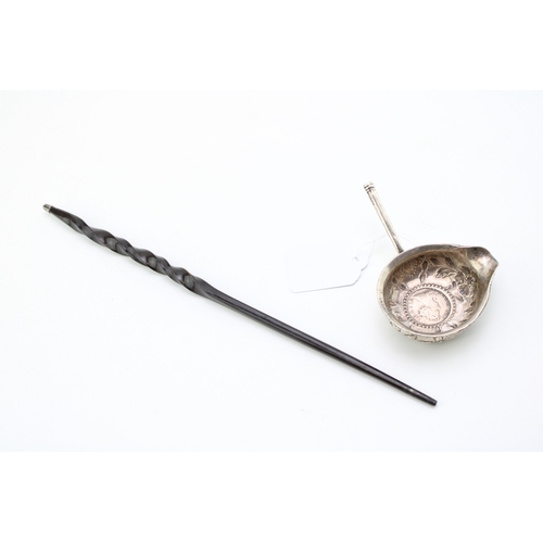 128 - A silver toddy ladle, likely 18th century with Queen Anne half crown inset, the bowl with rococo cha... 