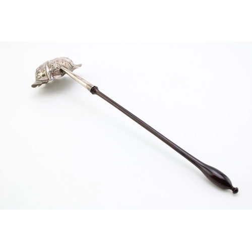 130 - A George III silver toddy ladle, the chased and repousse bowl with double pourer, with turned handle... 