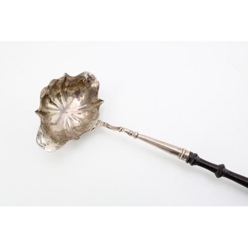 131 - A George III silver toddy ladle with double pouring bowl, of shell form, hallmarked to the bowl, mak... 