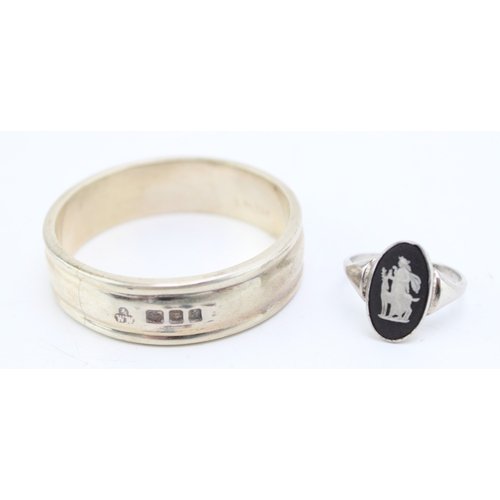 144 - A heavy silver serviette ring (33.9g) hallmarked London 1959 together with a silver Wedgwood Jasperw... 