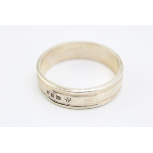 144 - A heavy silver serviette ring (33.9g) hallmarked London 1959 together with a silver Wedgwood Jasperw... 