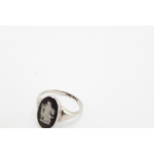 144 - A heavy silver serviette ring (33.9g) hallmarked London 1959 together with a silver Wedgwood Jasperw... 