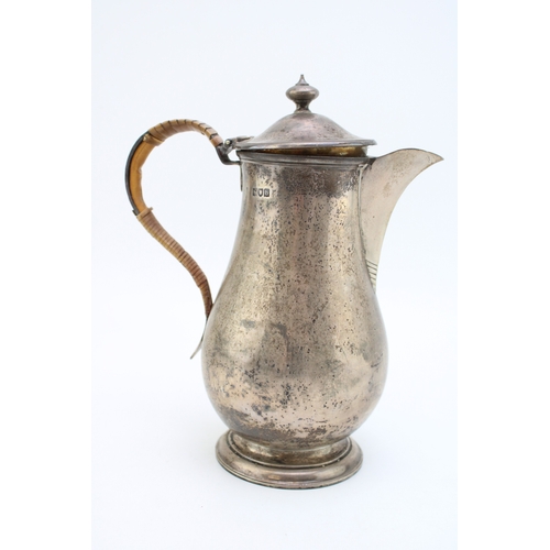 147 - A late Victorian silver hot water jug, hallmarked London 1897. Weight 554g