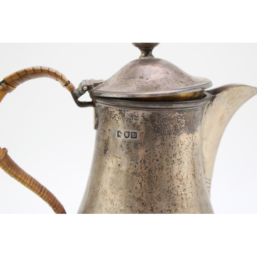 147 - A late Victorian silver hot water jug, hallmarked London 1897. Weight 554g