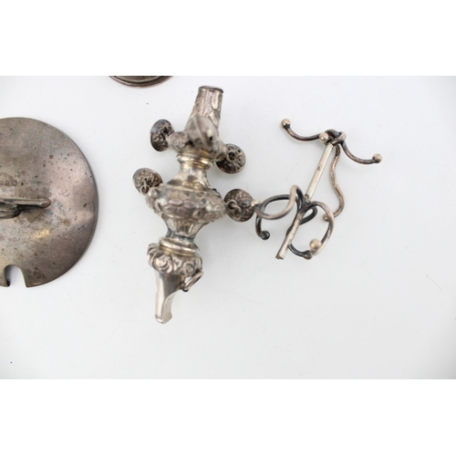 155 - A mixed collection of silver items to include a babies rattle a/f a silver hip flask funnel and othe... 