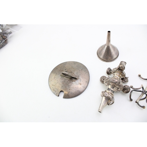 155 - A mixed collection of silver items to include a babies rattle a/f a silver hip flask funnel and othe... 