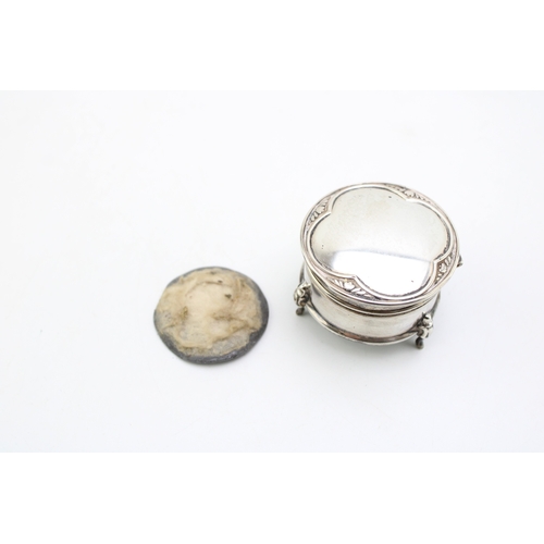 159 - A silver silk lined ring box with filled base raised on three Queen Anne style legs together with a ... 