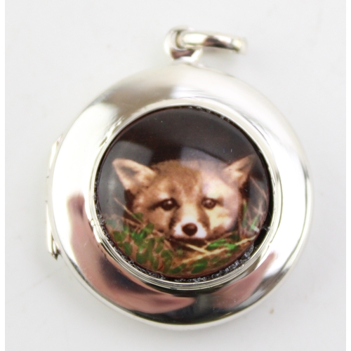 179 - Contemporary silver locket with transfer of a peeking fox, 2.5cm diameter.