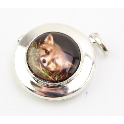 179 - Contemporary silver locket with transfer of a peeking fox, 2.5cm diameter.