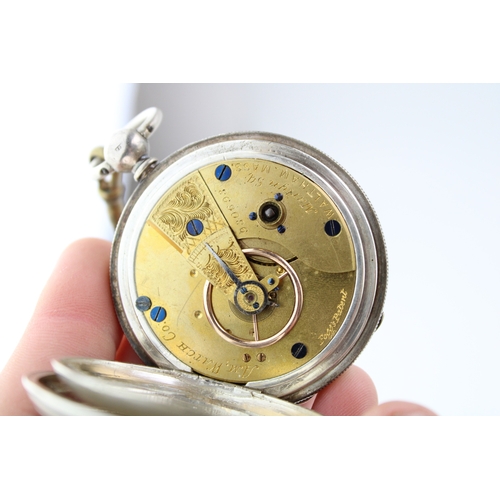 18 - Silver full hunter pocket watch, Chester 1875, winds and runs, 54mm wide.