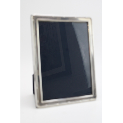 185 - A silver photo frame, hallmarked Sheffield 1994, 17.5cm x 12.5cm.