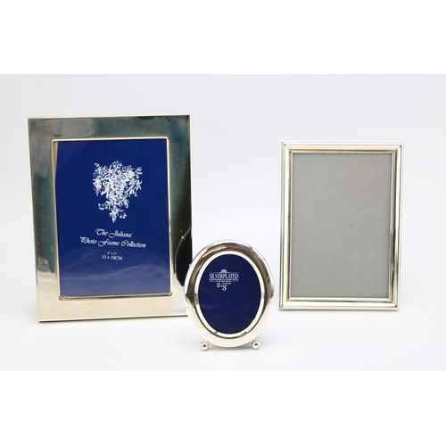 187 - A collection of silver plated photo frames to include two 13cm x 18cm (5