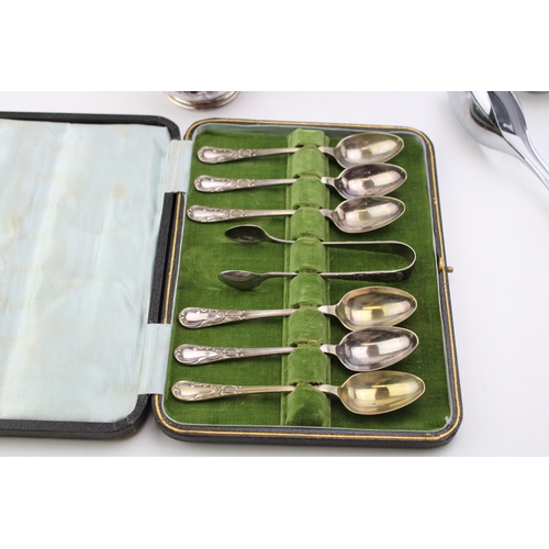 190 - A collection of silver plated items to include tea set and a set of cased spoons. (Qty)