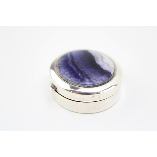 197 - Sterling silver pill box with inset Blue John to the lid, 33mm diameter.