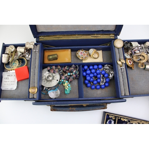 201 - Two vintage jewellery boxes with contents, including various silver thimbles, silver jewellery, a ja... 