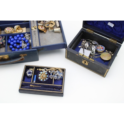 201 - Two vintage jewellery boxes with contents, including various silver thimbles, silver jewellery, a ja... 