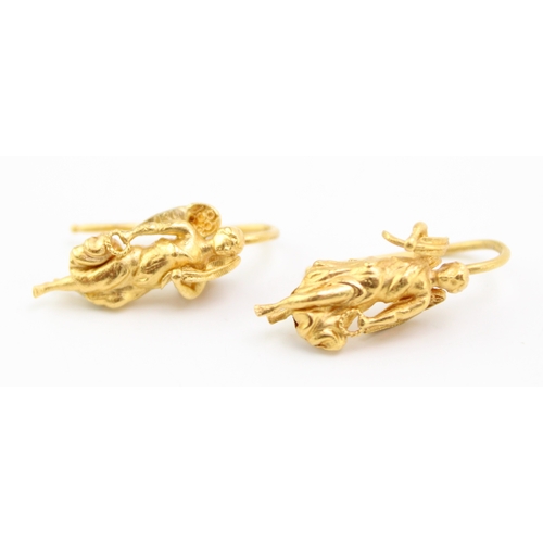 207 - A pair of high carat, likely 22ct gold earrings formed as angels in the Renaissance style, total wei... 