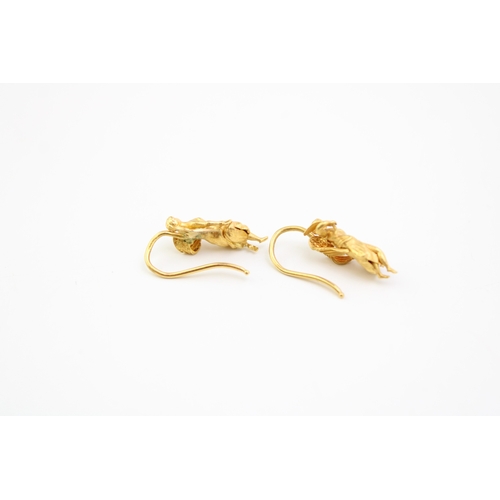 207 - A pair of high carat, likely 22ct gold earrings formed as angels in the Renaissance style, total wei... 