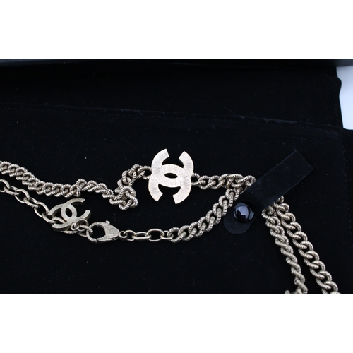 208 - A Chanel necklace, of rope textured curb links, with interlocking C logo at intervals, in two tone w... 