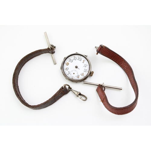 21 - A silver 925 cased trench style watch, missing hands, with two later leather albert chains (3).