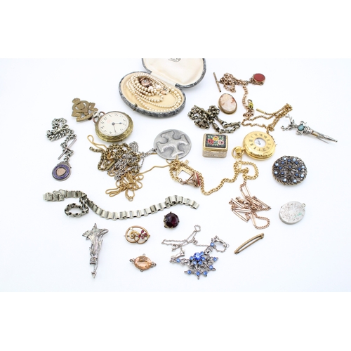 216 - A group of vintage costume jewellery including two strings of graduated simulated pearls, one with 9... 