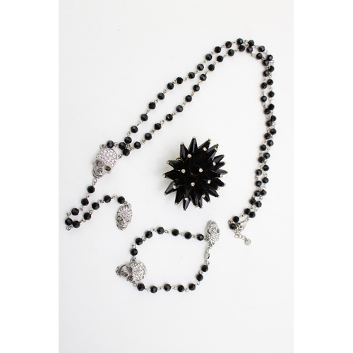 219 - Vintage Designer Jewellery: a Butler and Wilson diamante skull and faceted black bead necklace and m... 